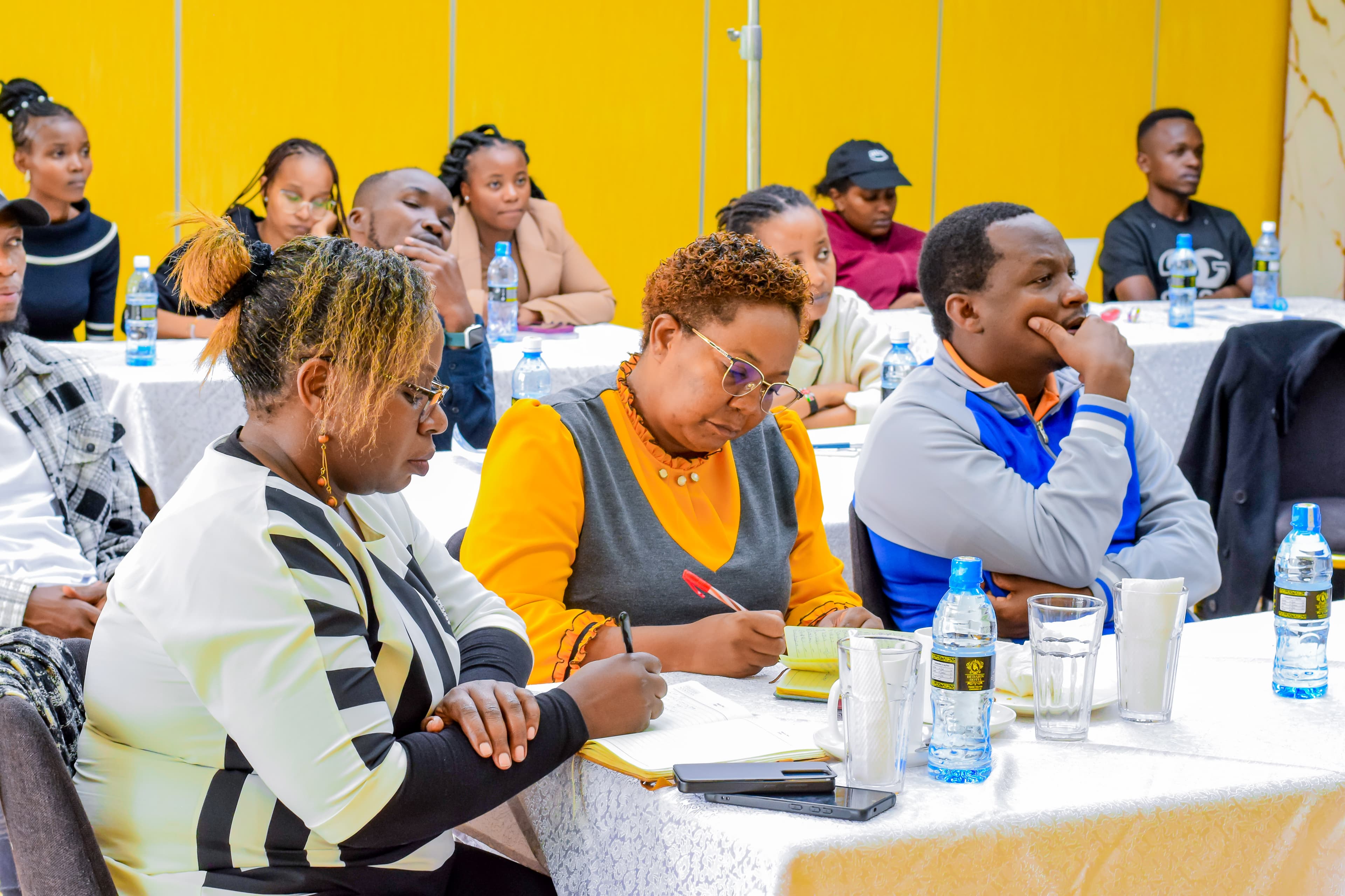 Participants working through an AI training exercise, photograph 8